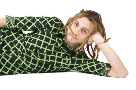young dreadlock man lies isolatedの写真素材