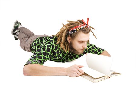young dreadlock man reading book isolatedの写真素材