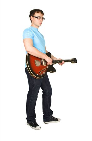 young man in glasses and blue shirt playing guitar isolated on whiteの写真素材