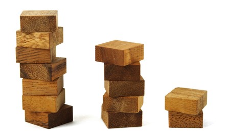 wooden square figures in pyramid isolatedの写真素材