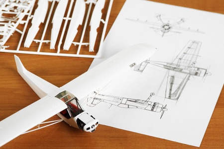 kit for assembling white plastic airplane model with scheme