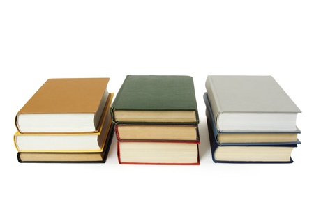  three stacks of books in hard cover, isolatedの写真素材