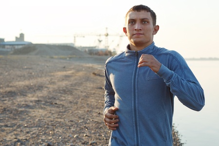 young man warming-up at early morningの写真素材