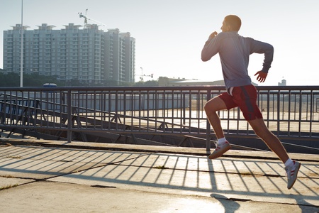 young man warming-up at early morning