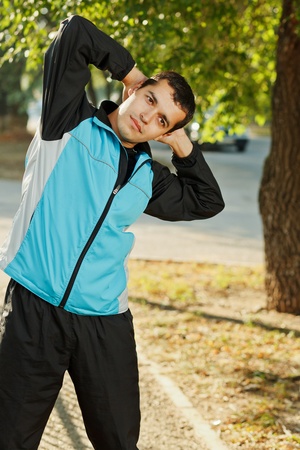 young man warming-up at early morningの写真素材