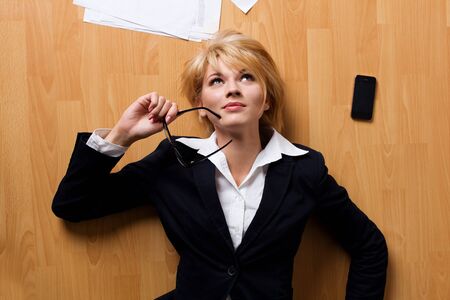 young businesswoman lying on floorの写真素材