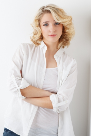Cheerful young blonde girl on white background, studio shotの写真素材
