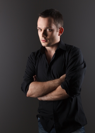 Handsome young male fashion model, in black shirtの写真素材