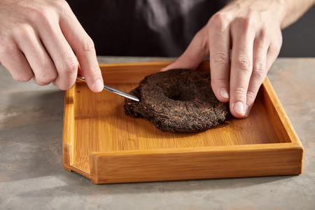 Close-up view of Professional cutting Pu'er tea.の写真素材
