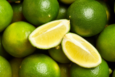 Bunch of fresh green limes in the organic food market