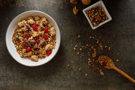 Bowl of granola with dried berries, walnuts and chocolate. Top viewの写真素材