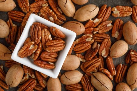 Bowl of pecan nuts. Copy spaceの写真素材