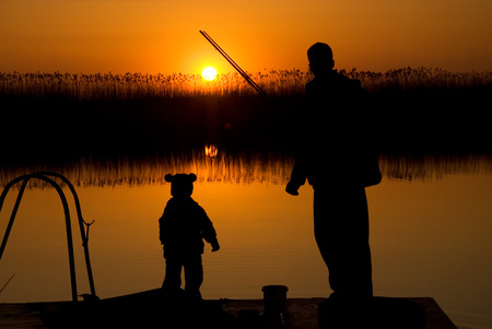 Dad and son fishingの写真素材