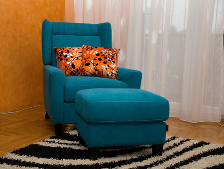 Armchair and footstool turquoiseの写真素材