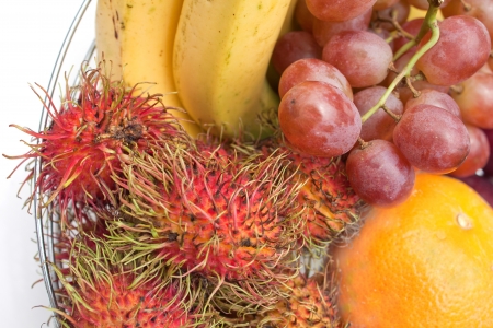 tropical fruit,rambutan,banana,grape and orangeの写真素材