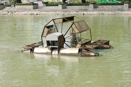 water wheel in pondの写真素材