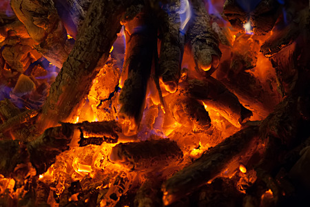 Red hot coals burning in stoveの写真素材