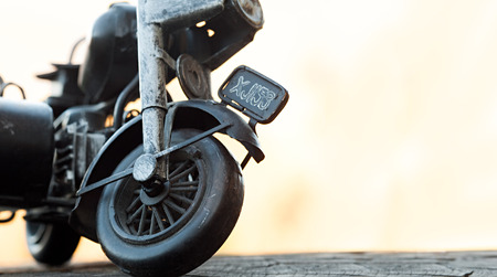 Close-up of miniature toy motorcycle on natural backgroundの写真素材