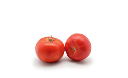 One fresh red tomato isolated on white backgroundの写真素材