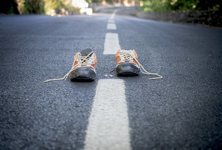 Pair of sneakers on the road