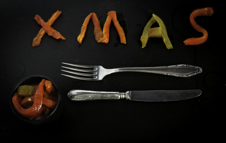 Christmas greeting with roasted peppersの写真素材