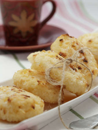 Sweet coconut macaroons with coffeeの写真素材