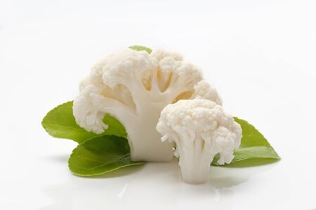 Cauliflower and green leaf on white backgroundの写真素材