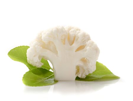 Piece of Cauliflower and green leaf on white backgroundの写真素材