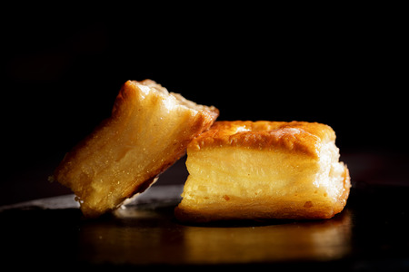 Delicious honey pastries on black backgroundの写真素材