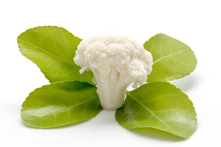 Piece of Cauliflower and green leaf on white backgroundの写真素材