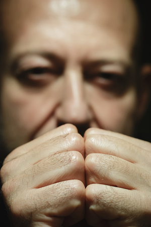 Close-up portrait of a man with intense lookの写真素材