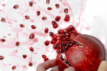 Ripe pomegranate fruit burstingの写真素材