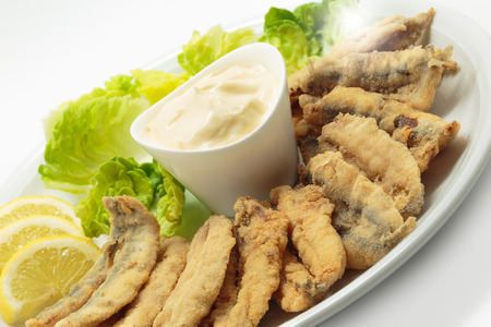 Fried anchovies with salad and mayonnaiseの写真素材
