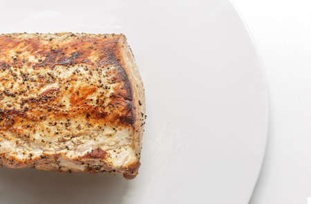 Roasted pork on white plateの写真素材