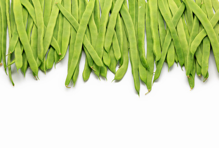 Pile of Green beans over isolated white backgroundの写真素材