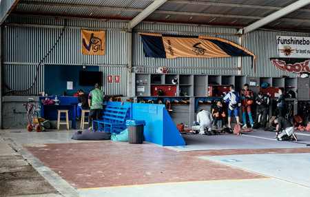 Seville, Spain - May 7, 2016: Group of skydivers preparing for jumping event, checking equipment. Skydive Spain preparation area. Skydive Spain is the skydiving center located at at La Juliana Aerodrome, about 20 km southwest of Seville, Spain. At Skydiveのeditorial素材