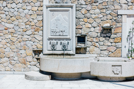 Curious stone fountain with rural scenes. Relief with a scene of dances and popular music. North of Spain. Lubian, Zamora. Lubián is a municipality located in the province of Zamora, Castile and León, Spainの写真素材