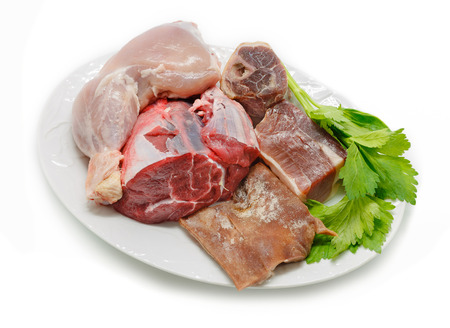 Typical Spanish cuisine. Some ingredients used to prepare spanish stew. Meats and vegetables isolatedの写真素材