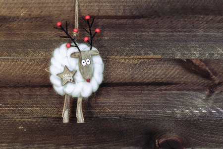 Christmas decoration. Christmas tree hanging over wooden background.の写真素材
