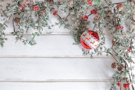 Christmas fir tree with decoration on white wooden boardの写真素材