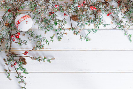 Christmas border design with snow covered pineconesの写真素材