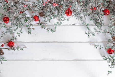 Christmas wooden background. Christmas jingle bells with a pine branchの写真素材