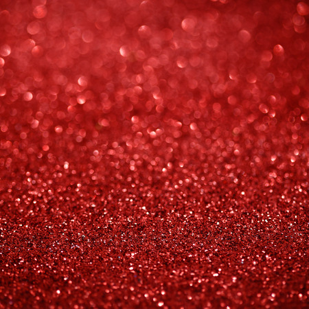 Defocused abstract red lights. Glitter Christmas backgroundの写真素材