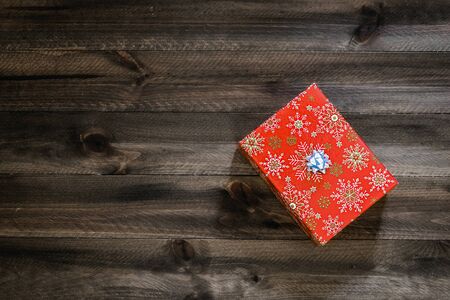 Christmas gift box on wooden table. Top view with copy spaceの写真素材