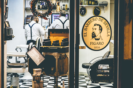 Seville, Spain - December 16, 2016: Exterior shot of vintage barbershop "El barbero de sevilla"  in the historical center of Seville, Spainのeditorial素材