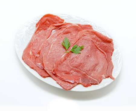 Raw beef meat isolated on white background.の写真素材