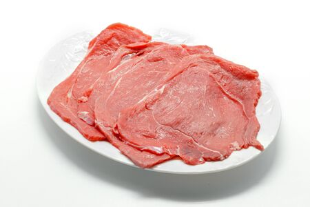 Raw beef meat isolated on white background.の写真素材
