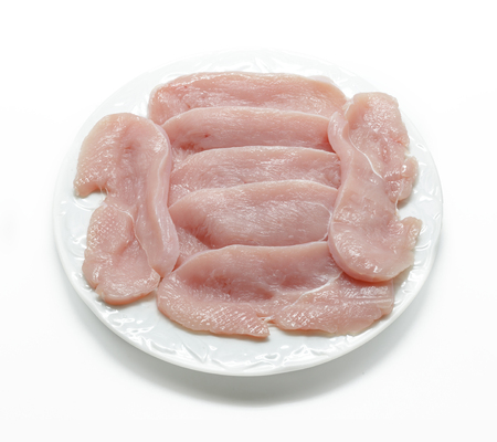Sliced raw meat isolated on whiteの写真素材
