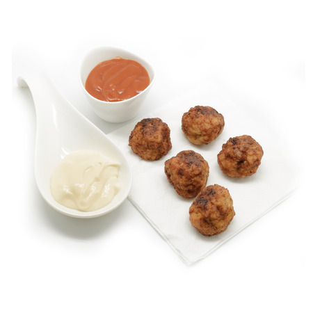 Meat balls with tomato sauce and salad cream on white backgroundの写真素材