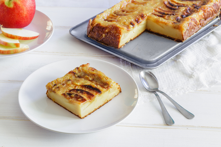 Delicious Homemade apple tart on a white wooden Background.の写真素材